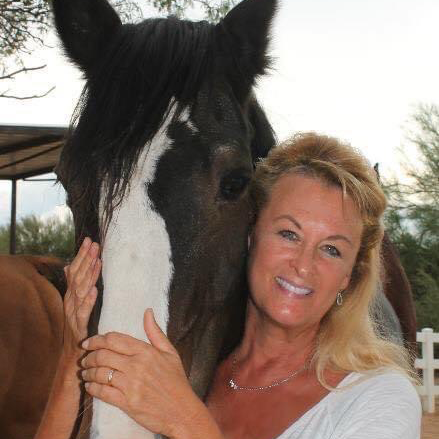 Ruth Waronker, Director and Owner, pictured with a rescued horse on the farm.